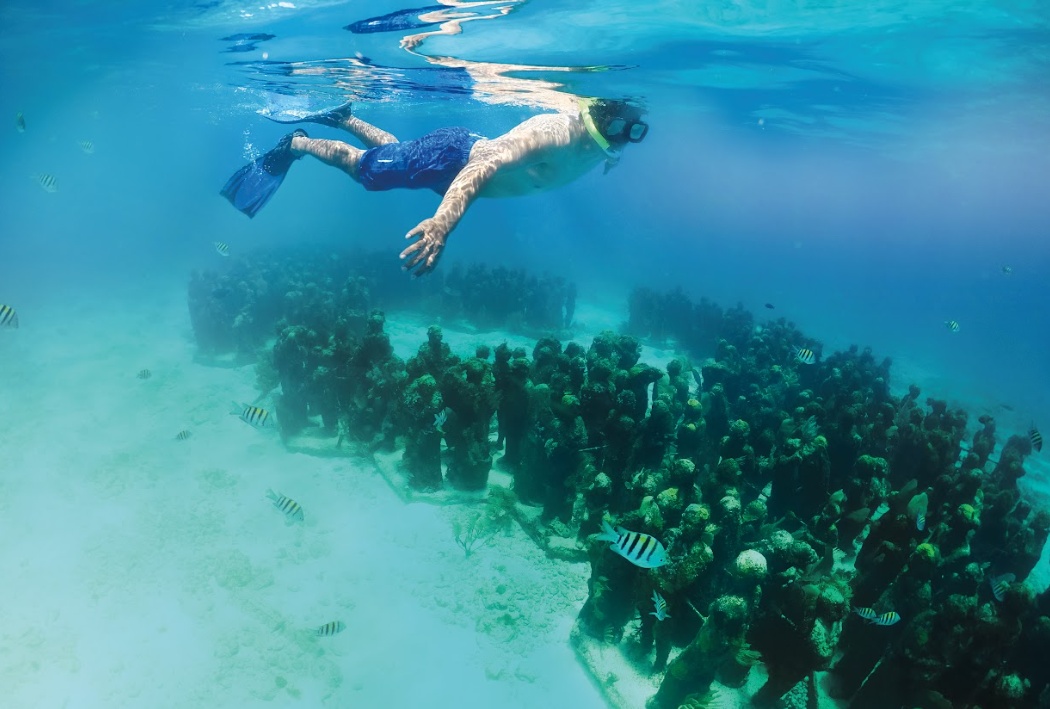 snorkel en el museo subacuatico del arte en cancun isla mujeres